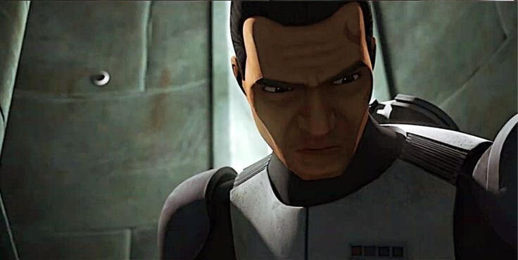 image of commander cody from the trailer of the bad batch season 2, looking downwards and frowning, face in the shadows.